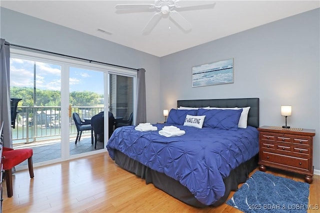 bedroom featuring access to exterior, ceiling fan, visible vents, and wood finished floors