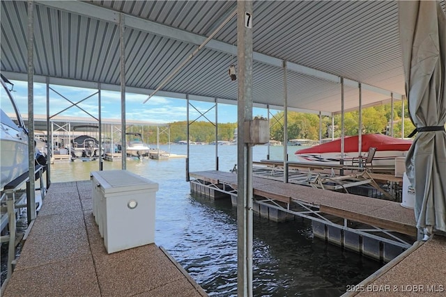 dock area with a water view and boat lift