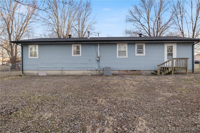 back of house featuring cooling unit and fence