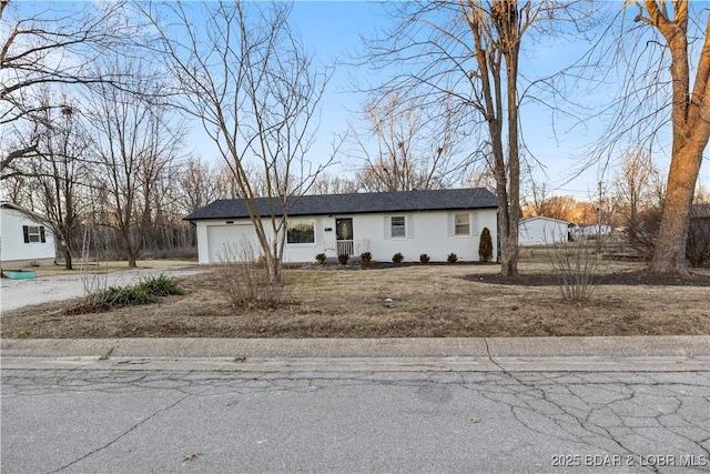 view of front of house featuring driveway and an attached garage