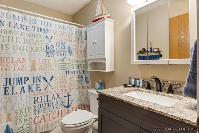 bathroom with a shower with shower curtain, vanity, toilet, and a textured ceiling