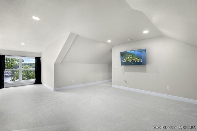 additional living space featuring carpet, vaulted ceiling, baseboards, and recessed lighting