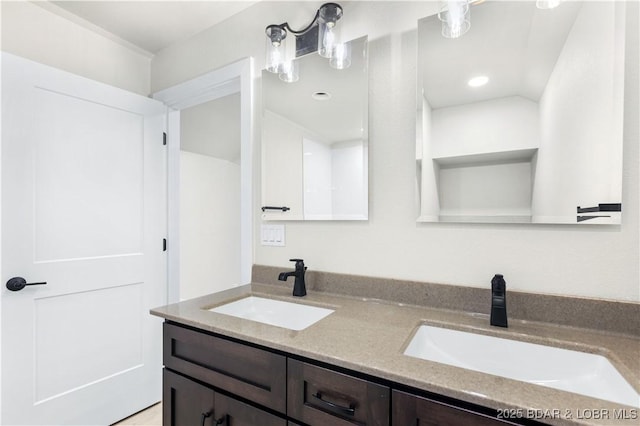 bathroom with a sink and double vanity