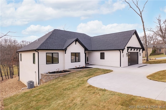 modern farmhouse style home featuring a shingled roof, concrete driveway, a front yard, stucco siding, and an attached garage