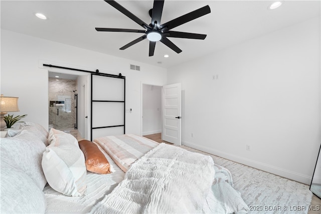 bedroom with visible vents, recessed lighting, baseboards, and a barn door