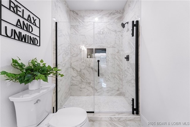 full bathroom with a marble finish shower, marble finish floor, and toilet