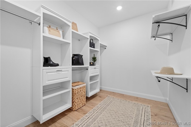 walk in closet featuring light wood-type flooring