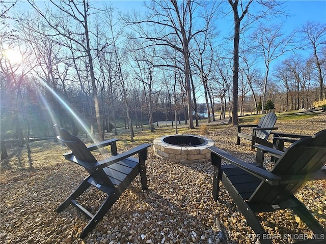 view of property's community with an outdoor fire pit