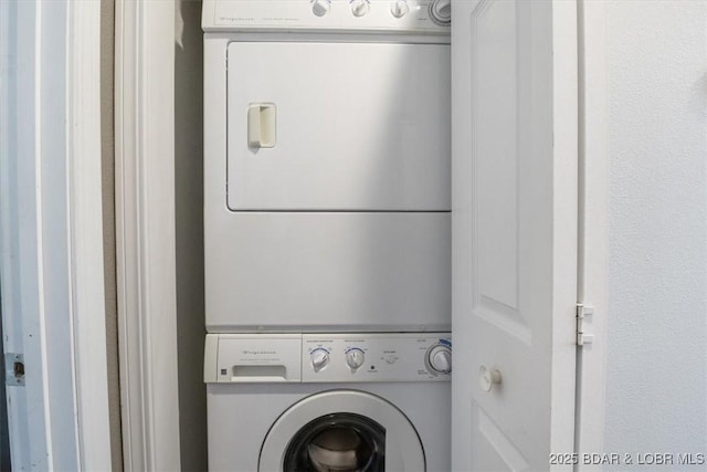 laundry area with laundry area and stacked washing maching and dryer