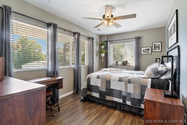 bedroom featuring ceiling fan, wood finished floors, and baseboards