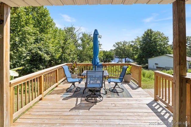 wooden deck featuring outdoor dining space