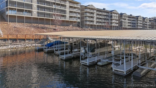 view of dock featuring a water view and boat lift