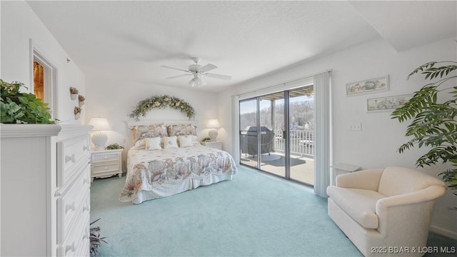 bedroom with access to outside, carpet, and a ceiling fan