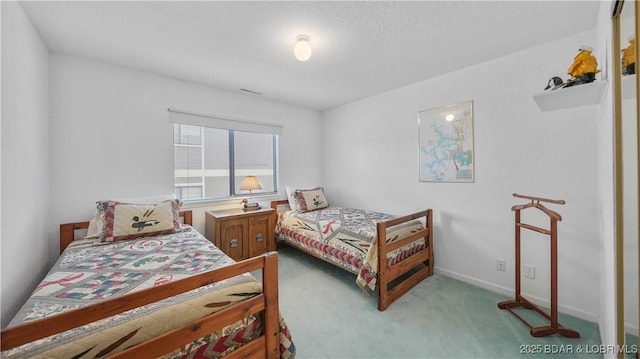 bedroom with carpet and baseboards