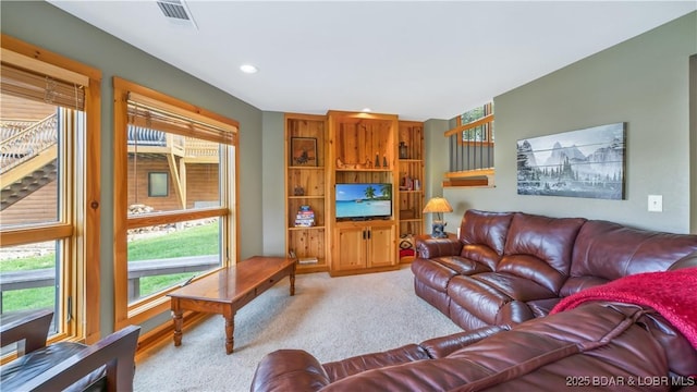 carpeted living room featuring recessed lighting and visible vents