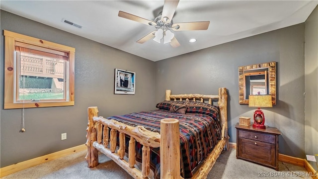 bedroom with ceiling fan, carpet, visible vents, and baseboards