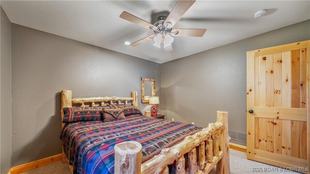 16959 Gentle Slopes Dr, Gravois Mills, MO 65037 - carpeted bedroom with baseboards and a ceiling fan