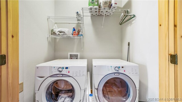 16959 Gentle Slopes Dr, Gravois Mills, MO 65037 - laundry area featuring separate washer and dryer