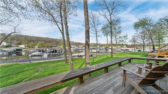 deck featuring a yard and a water view