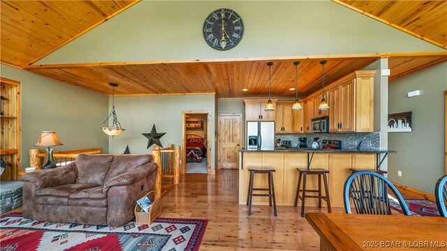 16959 Gentle Slopes Dr, Gravois Mills, MO 65037 - living area with wooden ceiling, light wood finished floors, and vaulted ceiling