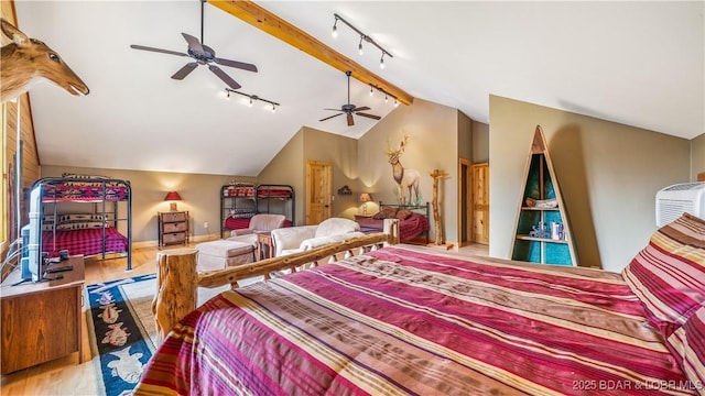 bedroom featuring vaulted ceiling with beams, wood finished floors, a ceiling fan, baseboards, and track lighting