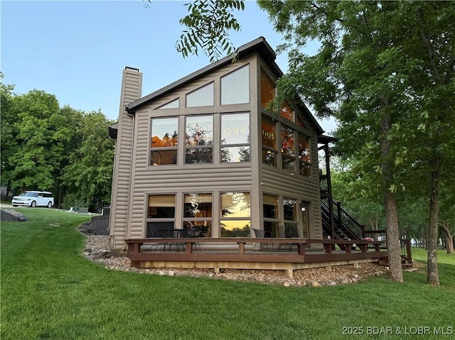 16959 Gentle Slopes Dr, Gravois Mills, MO 65037 - rear view of property with a chimney, a yard, and a wooden deck