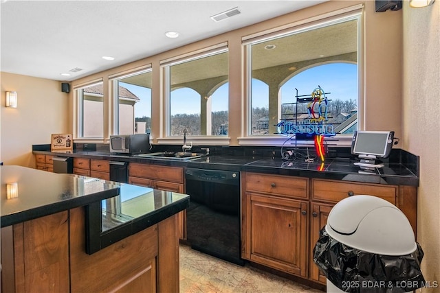260 Greystone Ln, Villages, MO 65079 - kitchen with brown cabinetry, dark countertops, dishwasher, and a sink