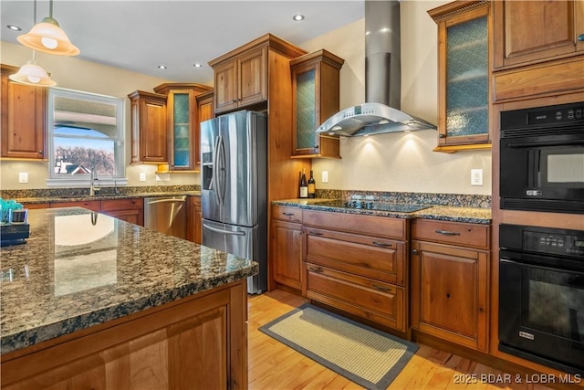 260 Greystone Ln, Villages, MO 65079 - kitchen featuring black appliances, wall chimney exhaust hood, light wood finished floors, brown cabinetry, and dark stone countertops