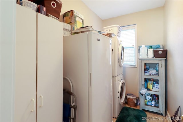 washroom with laundry area and stacked washer / dryer