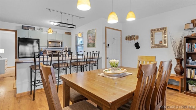 dining room featuring light wood finished floors