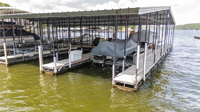 dock area featuring a water view and boat lift