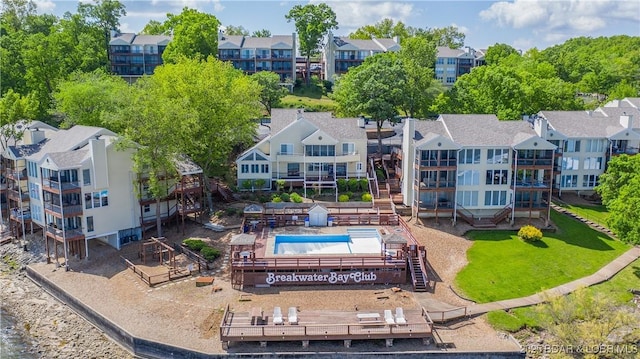 birds eye view of property with a residential view