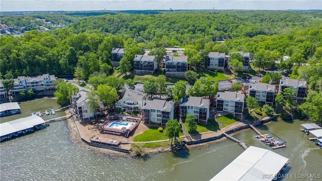 aerial view featuring a water view and a view of trees