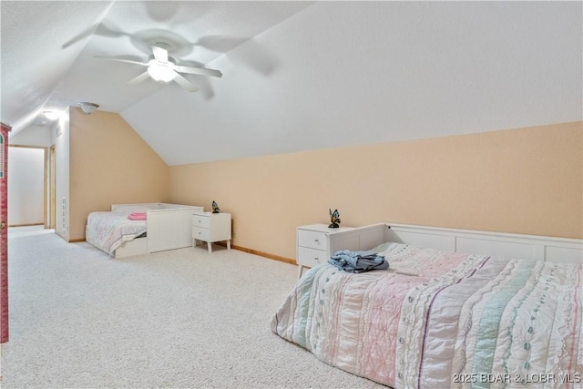 carpeted bedroom featuring vaulted ceiling, a ceiling fan, and baseboards