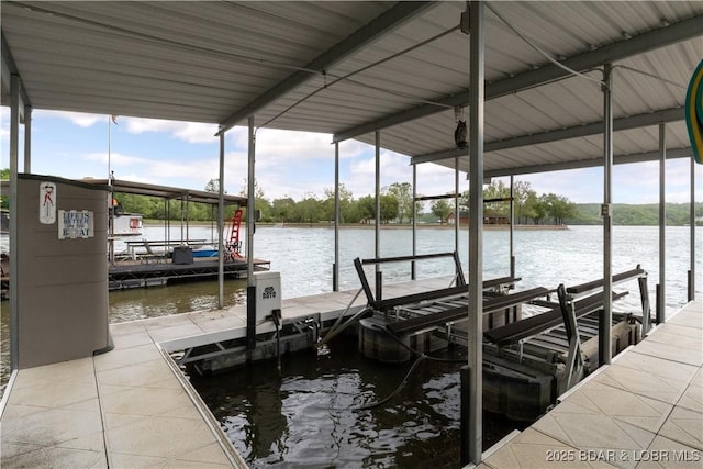 dock area with a water view and boat lift