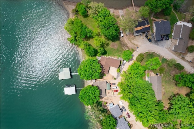 birds eye view of property featuring a water view and a residential view