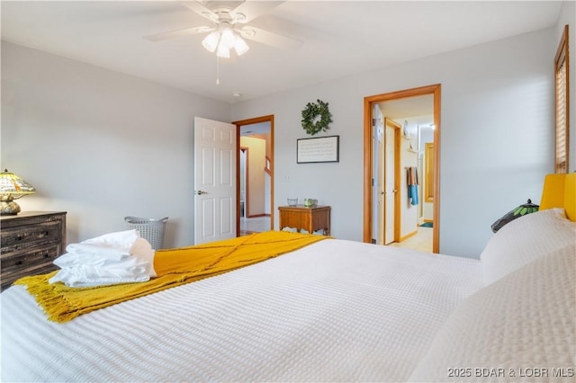 bedroom with ceiling fan and ensuite bath