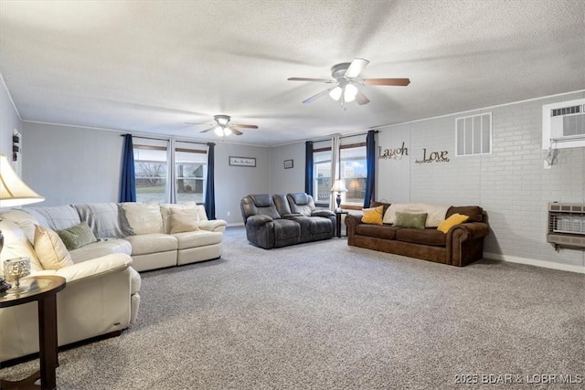 carpeted living area with heating unit, a ceiling fan, visible vents, and a textured ceiling