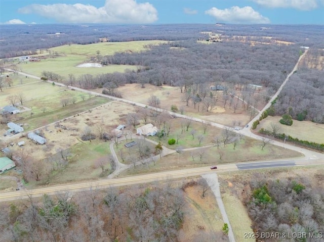 birds eye view of property featuring a rural view