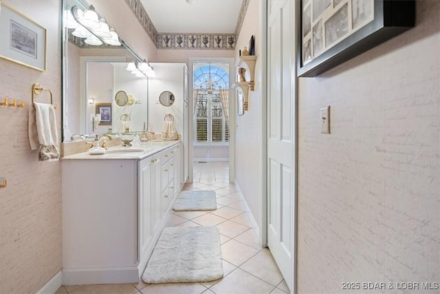 bathroom with tile patterned flooring and vanity