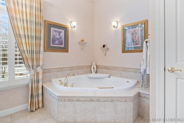 bathroom with a garden tub and tile patterned floors