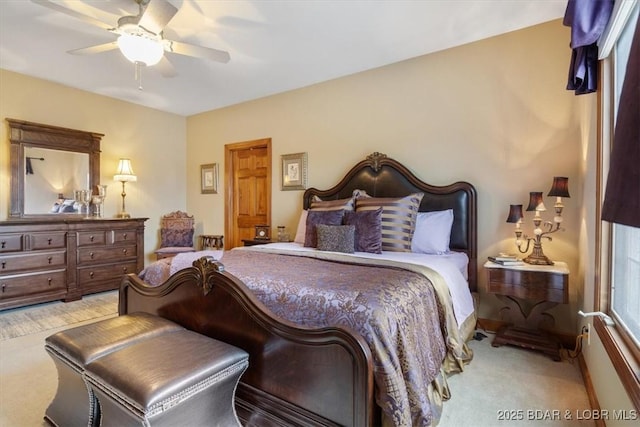 bedroom featuring carpet floors, ceiling fan, and baseboards