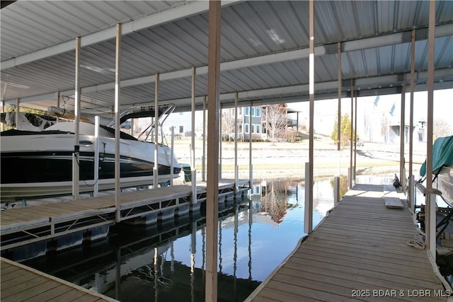 dock area featuring a water view and boat lift