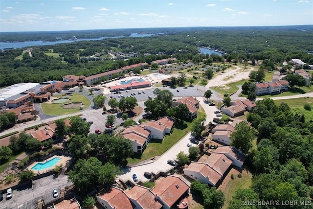 drone / aerial view featuring a view of trees