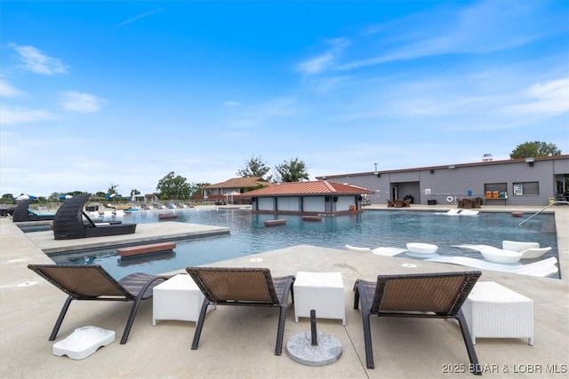 view of pool featuring a patio area