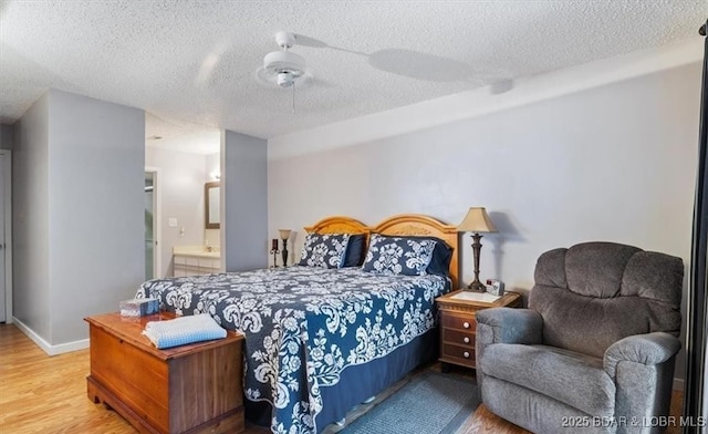 71 Costa Del Sol Dr Unit 207, Lake Ozark, MO 65049 - bedroom featuring ceiling fan, a textured ceiling, and wood finished floors