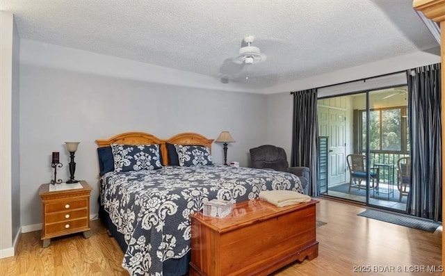 71 Costa Del Sol Dr Unit 207, Lake Ozark, MO 65049 - bedroom with baseboards, access to exterior, a textured ceiling, and wood finished floors