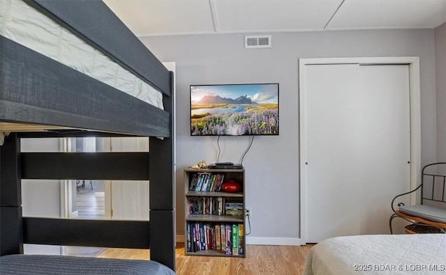 71 Costa Del Sol Dr Unit 207, Lake Ozark, MO 65049 - bedroom with visible vents, baseboards, and wood finished floors