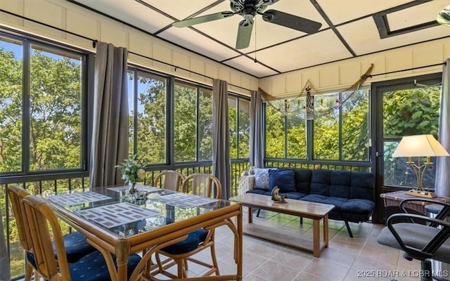 71 Costa Del Sol Dr Unit 207, Lake Ozark, MO 65049 - sunroom / solarium with outdoor lounge area, ceiling fan, and outdoor dining space