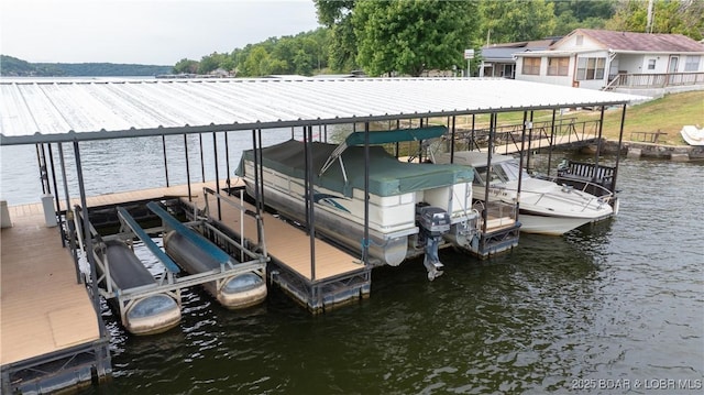 dock area featuring a water view and boat lift